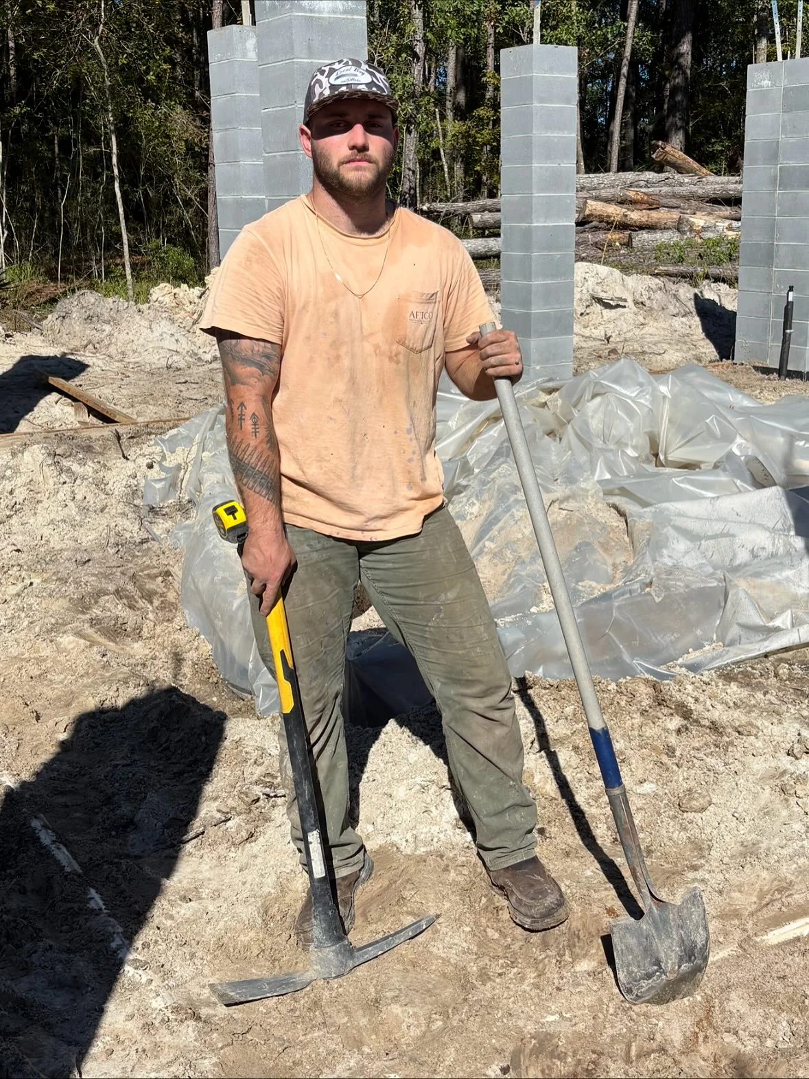 Chase Sandler working at a new construction plumbing site