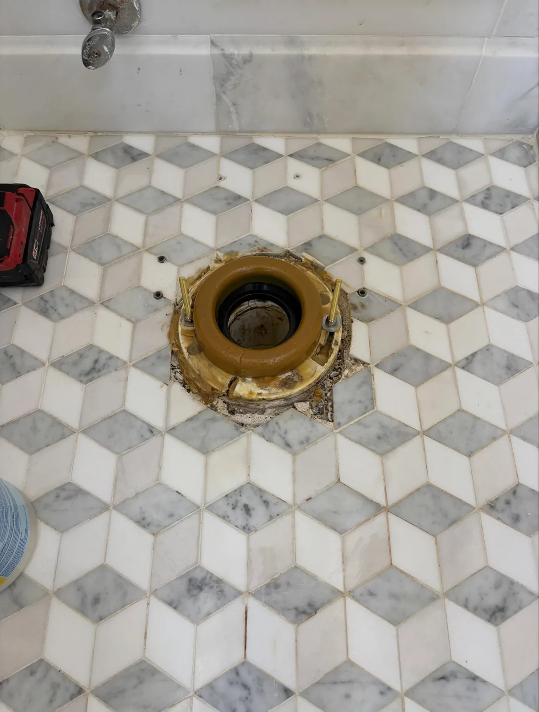Existing toilet flange prepared during a downtown Charleston toilet replacement