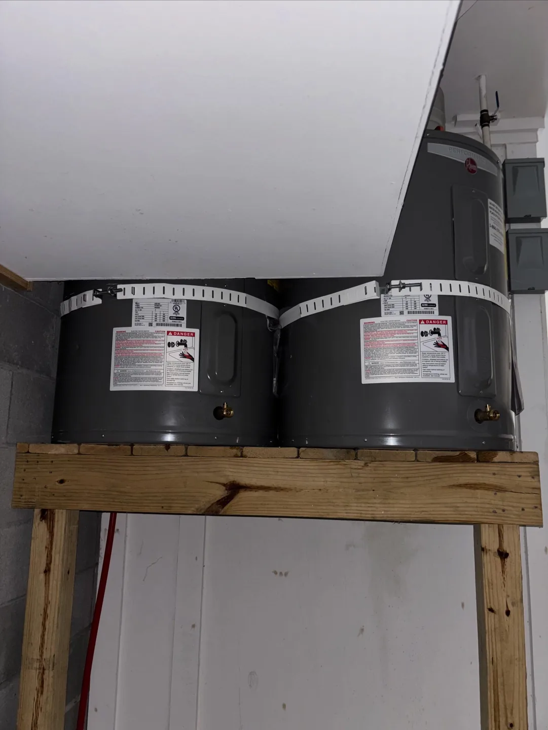 Two replacement water heaters installed in a compact Seabrook Island utility space
